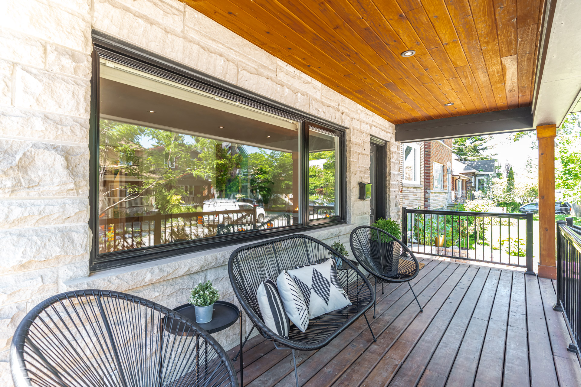 Covered front porch with cedar ceiling