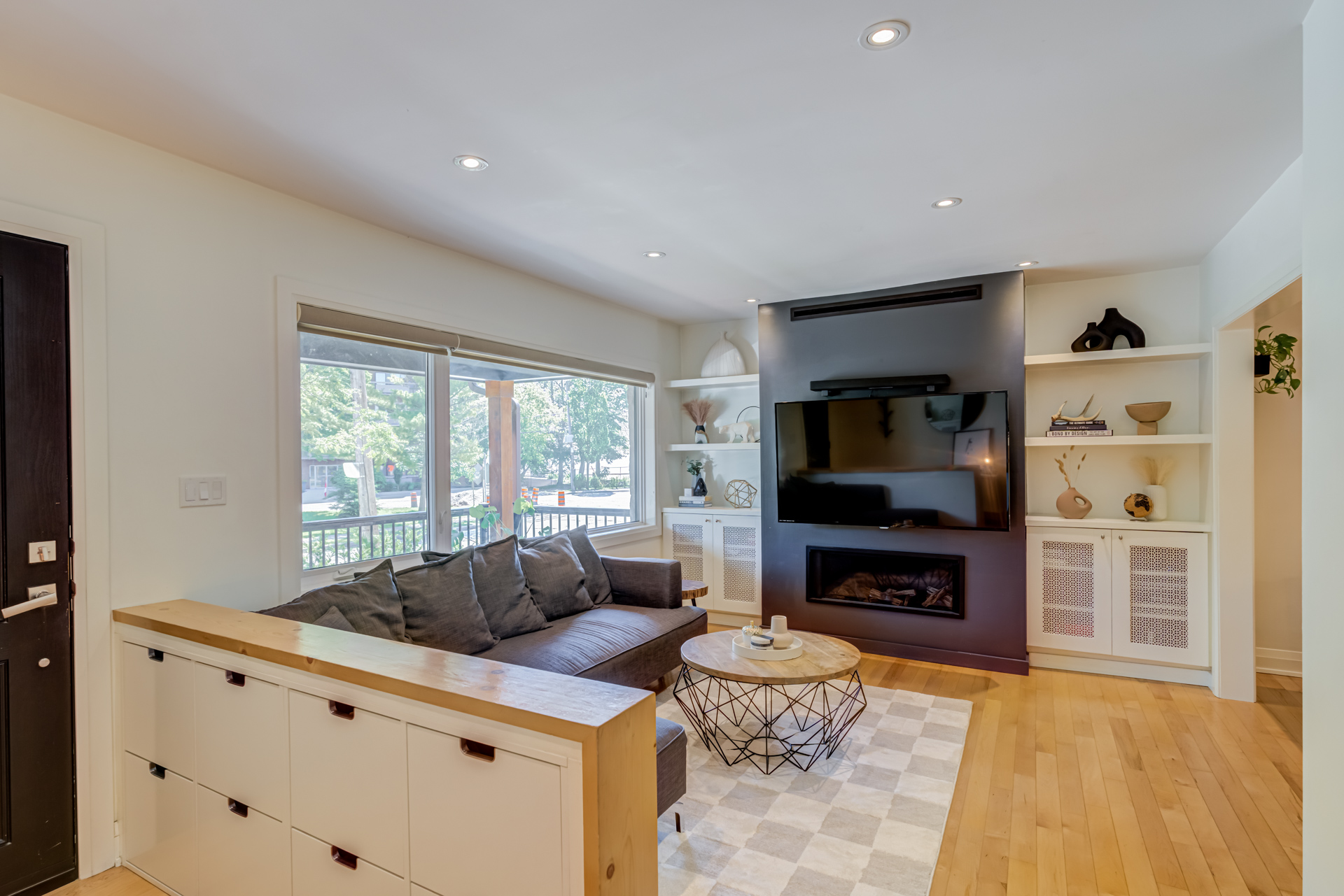 Living room with gas fireplace and built-ins